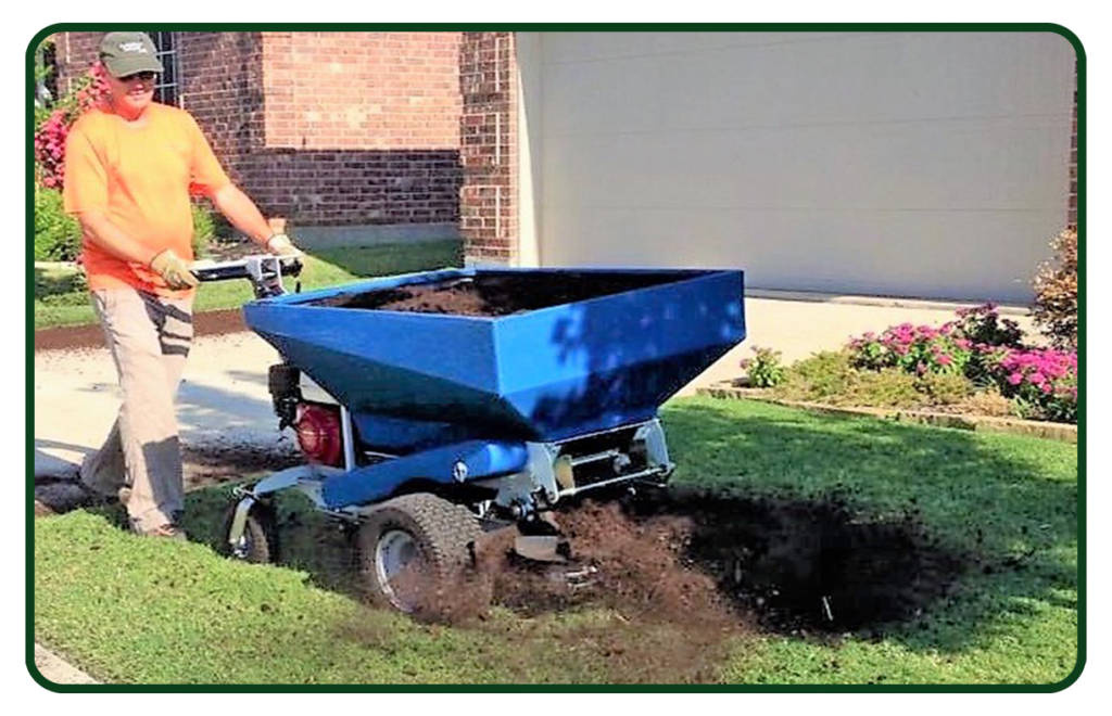 A person using a blue machine to grind dirt.